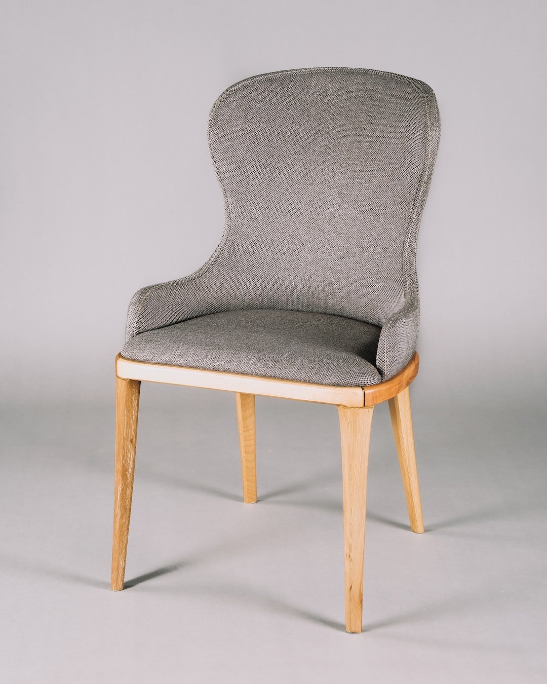 gray and white padded chair